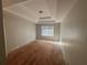 Bedroom offers tray ceilings, natural light, and neutral paint at 5761 Harrier Ln, Atlanta, GA 30349