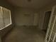 Bedroom with a window and two entry doors at 5761 Harrier Ln, Atlanta, GA 30349