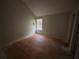Bedroom featuring high ceilings and a single window for natural light at 5761 Harrier Ln, Atlanta, GA 30349
