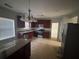 Kitchen features wood cabinets, granite counters, and stainless steel appliances at 5761 Harrier Ln, Atlanta, GA 30349