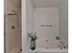 Clean bathroom featuring a glass-enclosed shower and a large soaking tub for relaxation at 5835 Terremont Cir, Norcross, GA 30093
