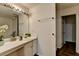 Bathroom features a vanity with sink, mirror, lighting, and access to a closet at 5835 Terremont Cir, Norcross, GA 30093