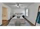 Bright bedroom with hardwood floors, a cozy bed, and a neutral color scheme at 5835 Terremont Cir, Norcross, GA 30093