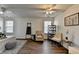 Spacious, well-lit bedroom featuring ceiling fans, hardwood floors and two windows at 5835 Terremont Cir, Norcross, GA 30093