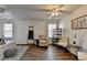 Spacious, well-lit bedroom featuring ceiling fans, hardwood floors and two windows at 5835 Terremont Cir, Norcross, GA 30093