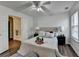 Bedroom featuring hardwood floors, a bed with a padded headboard and access to the bath at 5835 Terremont Cir, Norcross, GA 30093