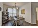 Charming dining room features a chandelier, table and chairs, and a decorative shelving unit at 5835 Terremont Cir, Norcross, GA 30093