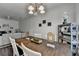 Cozy dining area with elegant lighting and view into the living room at 5835 Terremont Cir, Norcross, GA 30093