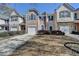 Well-maintained townhome with a clean driveway, charming curb appeal, and an attached garage at 5835 Terremont Cir, Norcross, GA 30093