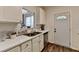 Well-lit kitchen features white cabinets and stainless steel appliances at 5835 Terremont Cir, Norcross, GA 30093