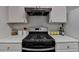Modern kitchen features white cabinets and a stainless steel oven at 5835 Terremont Cir, Norcross, GA 30093