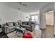 Inviting living room featuring comfortable seating, a view into the dining area, and contemporary decor at 5835 Terremont Cir, Norcross, GA 30093