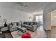 Bright and open living space with a fireplace, modern furnishings, and a view into the dining area at 5835 Terremont Cir, Norcross, GA 30093