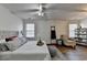 Spacious main bedroom featuring a king bed, chair, windows, and a decorative ladder at 5835 Terremont Cir, Norcross, GA 30093