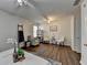 Bright main bedroom boasts hardwood floors, comfortable seating, and plenty of natural light at 5835 Terremont Cir, Norcross, GA 30093