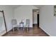 Inviting sitting area with hardwood floors, chairs, and view into hallway at 5835 Terremont Cir, Norcross, GA 30093