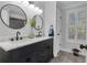 Stylish bathroom features a dual sink vanity, shiplap walls, and elegant fixtures at 121 Rising Star Rd, Fayetteville, GA 30215