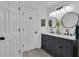 Bright bathroom with shiplap, double sinks, and ample lighting at 121 Rising Star Rd, Fayetteville, GA 30215