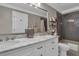 Bathroom with double vanity, marble countertops, gray tiled walls, modern fixtures, and bath tub at 121 Rising Star Rd, Fayetteville, GA 30215