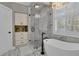 Luxurious bathroom featuring a glass enclosed shower and a soaking tub at 121 Rising Star Rd, Fayetteville, GA 30215