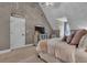 Cozy bedroom with a sloped ceiling, neutral tones, and lots of natural light at 121 Rising Star Rd, Fayetteville, GA 30215