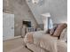 Comfortable bedroom with sloped ceiling, soft carpet, furniture, and plenty of natural light at 121 Rising Star Rd, Fayetteville, GA 30215