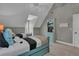 Bedroom featuring two beds, sloped ceilings, and natural light at 121 Rising Star Rd, Fayetteville, GA 30215