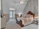 Comfortable bedroom with sloped ceiling, soft carpet, furniture, and plenty of natural light at 121 Rising Star Rd, Fayetteville, GA 30215