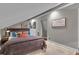 A well-decorated bedroom featuring a comfortable bed, stylish decor, and lots of light at 121 Rising Star Rd, Fayetteville, GA 30215