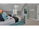 A well-decorated bedroom boasts unique blue beds, a storage cabinet, and neutral carpeting at 121 Rising Star Rd, Fayetteville, GA 30215