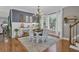 Dining room featuring a chandelier and hardwood floors and natural lighting at 121 Rising Star Rd, Fayetteville, GA 30215