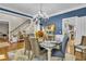 Formal dining room with chandelier, hardwood floors, blue walls, and elegant furnishings at 121 Rising Star Rd, Fayetteville, GA 30215
