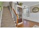 Grand entryway with staircase, hardwood floors, built-in display cabinet, wainscoting, and natural light at 121 Rising Star Rd, Fayetteville, GA 30215