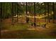 Backyard features a fire pit, surrounded by chairs and string lights at 121 Rising Star Rd, Fayetteville, GA 30215