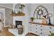 Stylish fireplace with brick surround, wooden mantel, and decorative accents on display at 121 Rising Star Rd, Fayetteville, GA 30215