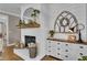 Close up of a brick fireplace with decorative accents and a white dresser at 121 Rising Star Rd, Fayetteville, GA 30215