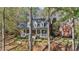 Charming brick home featuring a cozy front porch and beautifully landscaped front yard at 121 Rising Star Rd, Fayetteville, GA 30215