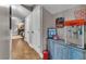 Hallway with wood floors and decorative vintage signs, a popcorn maker and other items displayed on a hutch at 121 Rising Star Rd, Fayetteville, GA 30215