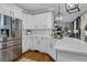 Kitchen with white cabinets, stainless steel refrigerator, and marble countertops at 121 Rising Star Rd, Fayetteville, GA 30215