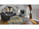 A large living room offers a comfortable leather sofa and chair with a large screen television at 121 Rising Star Rd, Fayetteville, GA 30215