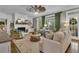 Bright living room featuring hardwood floors, fireplace, and a door to the porch at 121 Rising Star Rd, Fayetteville, GA 30215