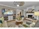 Spacious living room showcasing a fireplace, entertainment center, and cozy seating arrangements at 121 Rising Star Rd, Fayetteville, GA 30215