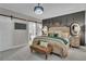 Charming main bedroom with gray accent wall, barn door and an ensuite bath at 121 Rising Star Rd, Fayetteville, GA 30215