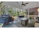 Comfortable covered porch featuring ceiling fan, outdoor furniture and bbq, perfect for entertaining at 121 Rising Star Rd, Fayetteville, GA 30215