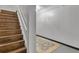 Stairwell with finished wood steps leads down to a finished basement space with room for activities at 121 Rising Star Rd, Fayetteville, GA 30215