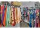 Well-organized walk-in closet with ample hanging space and shelving for optimal storage solutions at 121 Rising Star Rd, Fayetteville, GA 30215