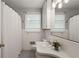 Bathroom featuring white tile, a shower with a curtain, patterned floor tile, and a modern vanity at 205 Glencourtney Dr, Sandy Springs, GA 30328