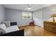 Bright bedroom features hardwood floors, natural light and daybed making it a cozy space at 205 Glencourtney Dr, Sandy Springs, GA 30328