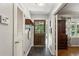 Bright foyer with coat closet and hardwood floors transitioning into living space at 205 Glencourtney Dr, Sandy Springs, GA 30328