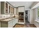 Well-equipped kitchen with granite countertops, glass-front cabinets, and stainless-steel oven at 205 Glencourtney Dr, Sandy Springs, GA 30328